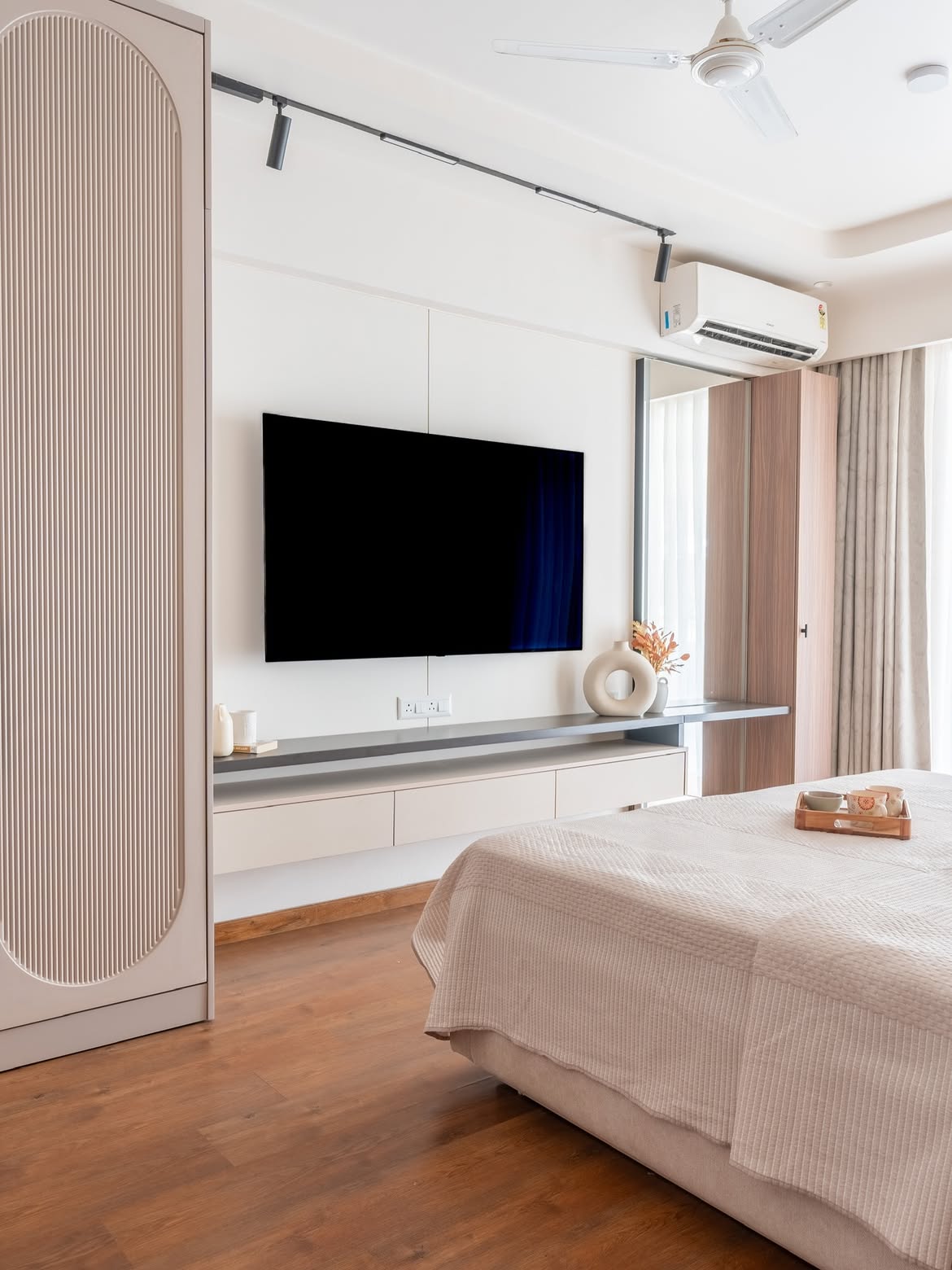 Interior designers DLF Garden City modern bedroom TV unit design