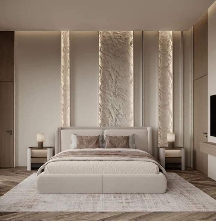 Backlit or cove-lit panel wall design in a bedroom
